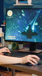 Concentrated gamer playing first-person space shooter game